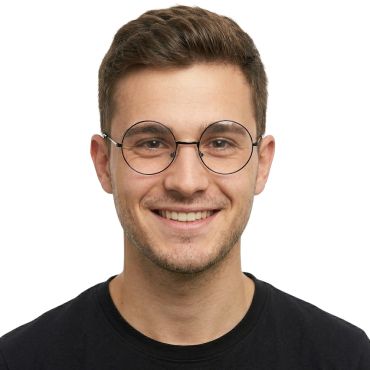 Homme souriant portant des lunettes rondes à fine monture noire | jourdefete.com